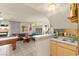 Open floor plan featuring a wet bar adjacent to the living room and backyard access at 5361 Cabrito Dr, Las Vegas, NV 89103