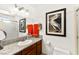 Modern bathroom with granite countertop, framed art, and well lit vanity mirror at 5361 Cabrito Dr, Las Vegas, NV 89103