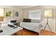 Bright bedroom with hardwood floors, a daybed, and a desk for a perfect workspace at 5361 Cabrito Dr, Las Vegas, NV 89103