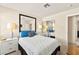 Bedroom featuring white linens and blue pillows and view of the mirrored closet at 5361 Cabrito Dr, Las Vegas, NV 89103