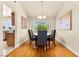 Cozy dining room with hardwood floors and a charming chandelier above the table at 5361 Cabrito Dr, Las Vegas, NV 89103