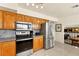 Modern kitchen with stainless steel appliances, granite countertops, and ample cabinet space at 5361 Cabrito Dr, Las Vegas, NV 89103