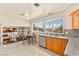 Well-lit kitchen featuring stainless steel appliances, granite countertops, and tiled flooring at 5361 Cabrito Dr, Las Vegas, NV 89103