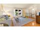Spacious living room with hardwood floors, cozy seating, and large windows at 5361 Cabrito Dr, Las Vegas, NV 89103