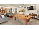 Open concept floor plan featuring a pool table, living area, and eat-in kitchen upstairs at 5361 Cabrito Dr, Las Vegas, NV 89103
