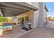 Back patio with outdoor seating and a grill for cooking and entertaining at 5361 Cabrito Dr, Las Vegas, NV 89103