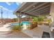 Inviting in-ground pool with a covered patio and outdoor bar area at 5361 Cabrito Dr, Las Vegas, NV 89103