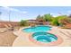 In-ground pool and hot tub, surrounded by lush landscaping and a lounging area at 5361 Cabrito Dr, Las Vegas, NV 89103