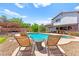 Relaxing backyard with lounge chairs, pool, and beautiful landscaping perfect for entertaining at 5361 Cabrito Dr, Las Vegas, NV 89103