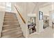 Inviting staircase with carpeted steps and wooden handrail leading to the upper level at 5361 Cabrito Dr, Las Vegas, NV 89103