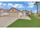 Charming single-story home featuring desert landscaping, a two-car garage, and a terracotta tile roof at 5512 Kettering Pl, Las Vegas, NV 89107