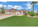 Charming single-story home with manicured lawn and desert landscaping and attached two-car garage at 5512 Kettering Pl, Las Vegas, NV 89107