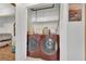 Bright laundry area with a large washer and dryer setup and extra storage at 5512 Kettering Pl, Las Vegas, NV 89107