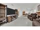 Open-concept living room with a fireplace, mounted flat screen TV and easy access to dining area at 5512 Kettering Pl, Las Vegas, NV 89107