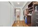 A walk-in closet features ample clothing and shoe storage, including open shelving and full-length hanging racks at 5512 Kettering Pl, Las Vegas, NV 89107