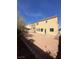 Spacious backyard with low maintenance landscaping, patio area, and secure fencing at 6525 Bismark Hills St, North Las Vegas, NV 89084