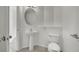 White sink, toilet, and fixtures in a neutral bathroom at 6525 Bismark Hills St, North Las Vegas, NV 89084
