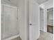 Bathroom with enclosed shower and views into hall and bedroom at 6525 Bismark Hills St, North Las Vegas, NV 89084