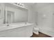 Bathroom with dual sinks, vanity, large mirror, and tub-shower combo at 6525 Bismark Hills St, North Las Vegas, NV 89084