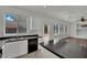 The kitchen features stainless steel appliances, bright lighting, and backyard access at 6525 Bismark Hills St, North Las Vegas, NV 89084
