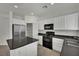 Beautiful kitchen with stainless steel refrigerator, microwave, and gas range at 6525 Bismark Hills St, North Las Vegas, NV 89084