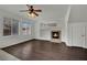 Bright living room with hardwood floors, large windows, fireplace, and neutral color palette at 6525 Bismark Hills St, North Las Vegas, NV 89084