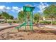 Community playground with play structure and shade from mature landscaping at 6525 Bismark Hills St, North Las Vegas, NV 89084