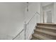 Carpeted stairway with landing and hanging light fixture at 6525 Bismark Hills St, North Las Vegas, NV 89084