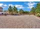 Sandy volleyball court with surrounding greenery in a well-maintained community area at 6525 Bismark Hills St, North Las Vegas, NV 89084