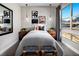 Comfortable bedroom with modern décor, including stylish lighting and a large window with a scenic view at 664 Agate Bridge St, Las Vegas, NV 89138
