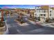 Street view of a planned community entrance, with new construction and attractive landscaping at 664 Agate Bridge St, Las Vegas, NV 89138