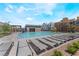 Community pool area with lounge chairs and a covered structure, ideal for relaxation and recreation at 664 Agate Bridge St, Las Vegas, NV 89138
