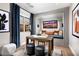 Cozy home office featuring built-in shelves, a comfortable seating area, and ample natural light at 664 Agate Bridge St, Las Vegas, NV 89138