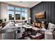 Chic living room filled with light, modern decor, hardwood floors, and eye-catching accent wall at 664 Agate Bridge St, Las Vegas, NV 89138