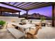 Inviting outdoor patio with comfortable seating and a stunning mountain view, perfect for relaxing and entertaining at 664 Agate Bridge St, Las Vegas, NV 89138