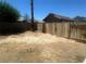 Spacious backyard featuring a tall tree, wooden fence, and privacy wall offers a relaxing outdoor space at 681 Pine Ridge Dr, Las Vegas, NV 89110