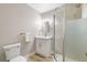 A bathroom featuring a walk-in shower with a glass partition, vanity, and a modern toilet at 681 Pine Ridge Dr, Las Vegas, NV 89110