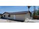 Exterior view of single story home showcasing a neutral paint, desert landscaping, and roof at 681 Pine Ridge Dr, Las Vegas, NV 89110