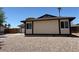 Well-maintained home featuring neutral stucco, brown trim, desert landscaping, and garage access at 681 Pine Ridge Dr, Las Vegas, NV 89110