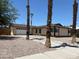Charming single-story home with desert landscaping, a driveway, and an attached garage at 681 Pine Ridge Dr, Las Vegas, NV 89110