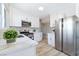 Modern kitchen equipped with stainless steel appliances and bright white cabinets at 681 Pine Ridge Dr, Las Vegas, NV 89110