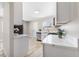 Contemporary kitchen with white cabinets, stainless appliances, and quartz countertops at 681 Pine Ridge Dr, Las Vegas, NV 89110