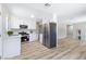 Well-lit kitchen featuring stainless steel appliances and modern white cabinetry at 681 Pine Ridge Dr, Las Vegas, NV 89110