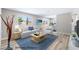 Staged living room featuring a bright sitting area with contemporary decor and wood-look flooring at 681 Pine Ridge Dr, Las Vegas, NV 89110