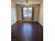 This bedroom is naturally bright and features dark wood flooring and neutral walls at 6955 N Durango Dr # 1038, Las Vegas, NV 89149