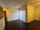 Living room features dark floors and a sliding glass door to a balcony at 6955 N Durango Dr # 1038, Las Vegas, NV 89149