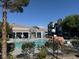 A beautiful community pool surrounded by trees and apartment buildings at 6955 N Durango Dr # 1038, Las Vegas, NV 89149