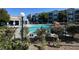 A sparkling community pool with lush landscaping and nearby condos at 6955 N Durango Dr # 1038, Las Vegas, NV 89149