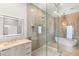 Modern bathroom featuring a light up mirror, vanity with sink, and onyx shower with a tub at 7185 Ranchito Cir, Las Vegas, NV 89120