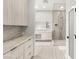 Bright bathroom featuring a vanity, drawers for storage, and glass shower with a rainfall showerhead at 7185 Ranchito Cir, Las Vegas, NV 89120